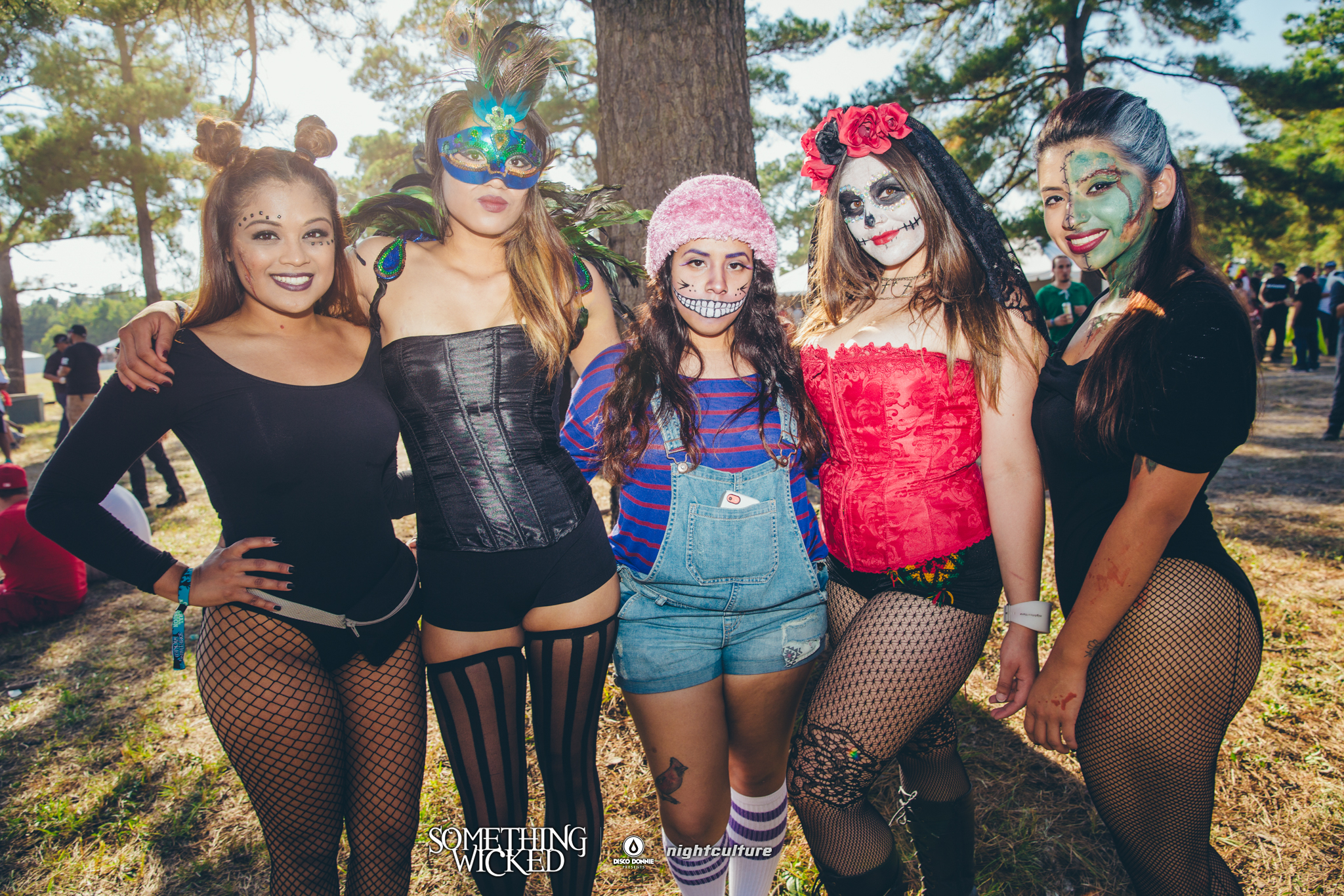 festive fans with masks and costumes