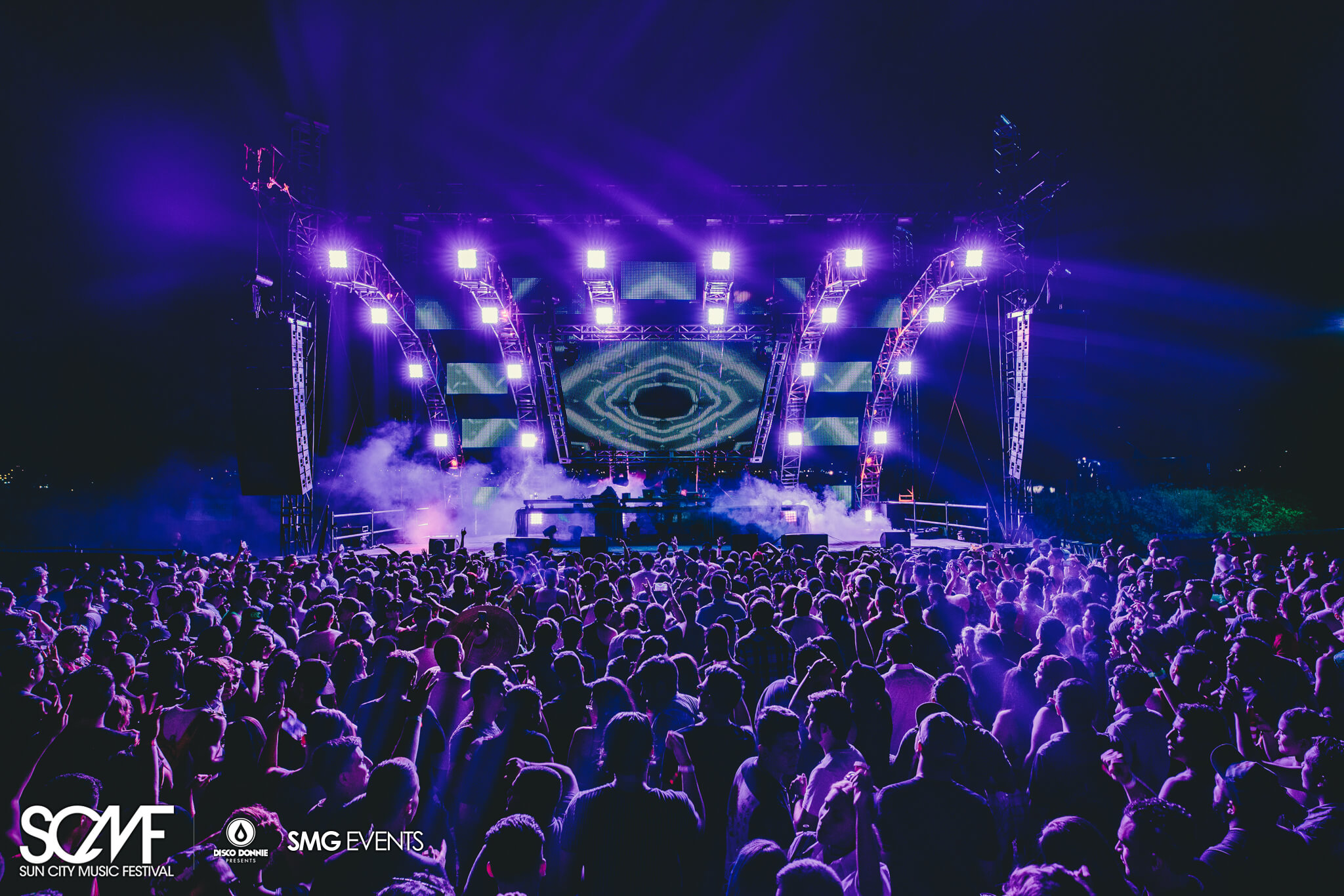 stage and crowd in purple haze