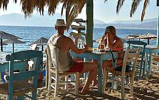 Eine lohnende Investition - die Dachdämmung Bild: Strandbar, Sonne, Palmen