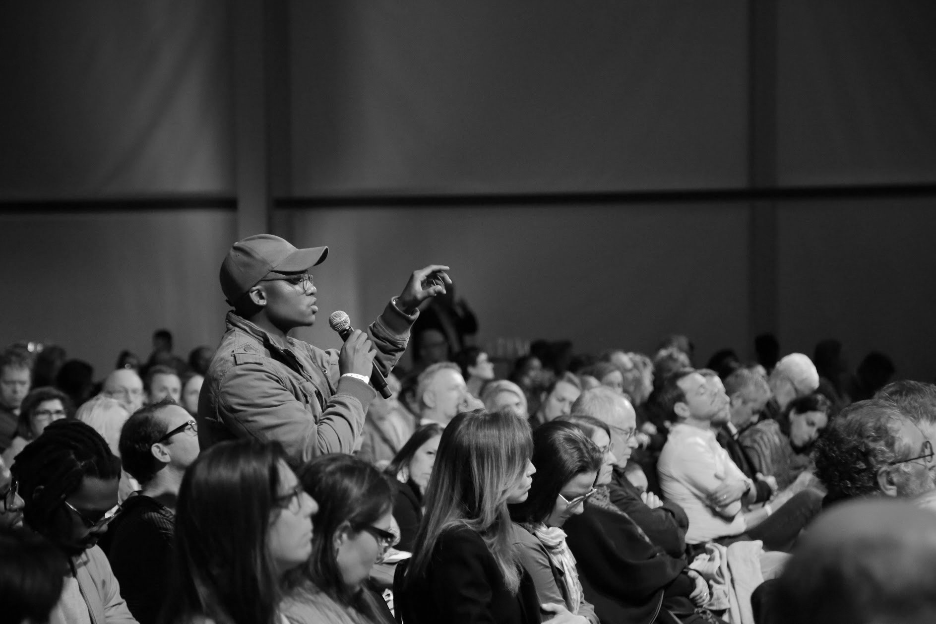 A crowd gathering for the Daily Maverick in black and white