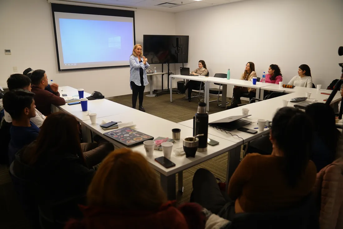 Person presenting in conference room