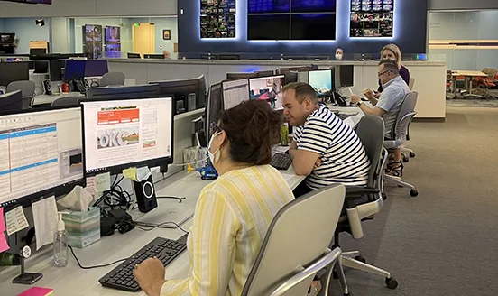 Reporters working in the KFOR newsroom