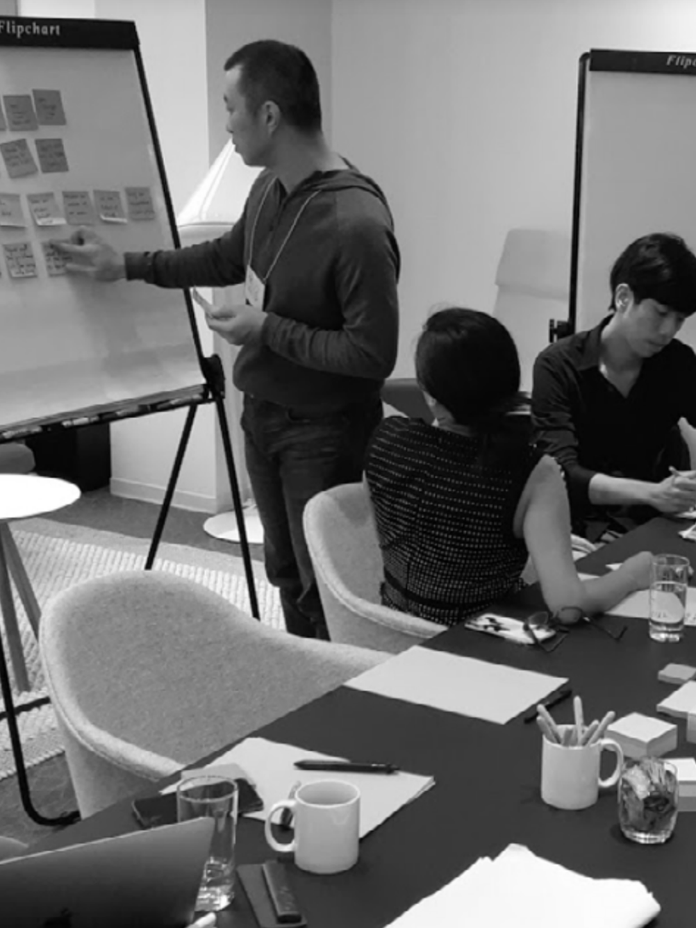 Person presenting in conference room