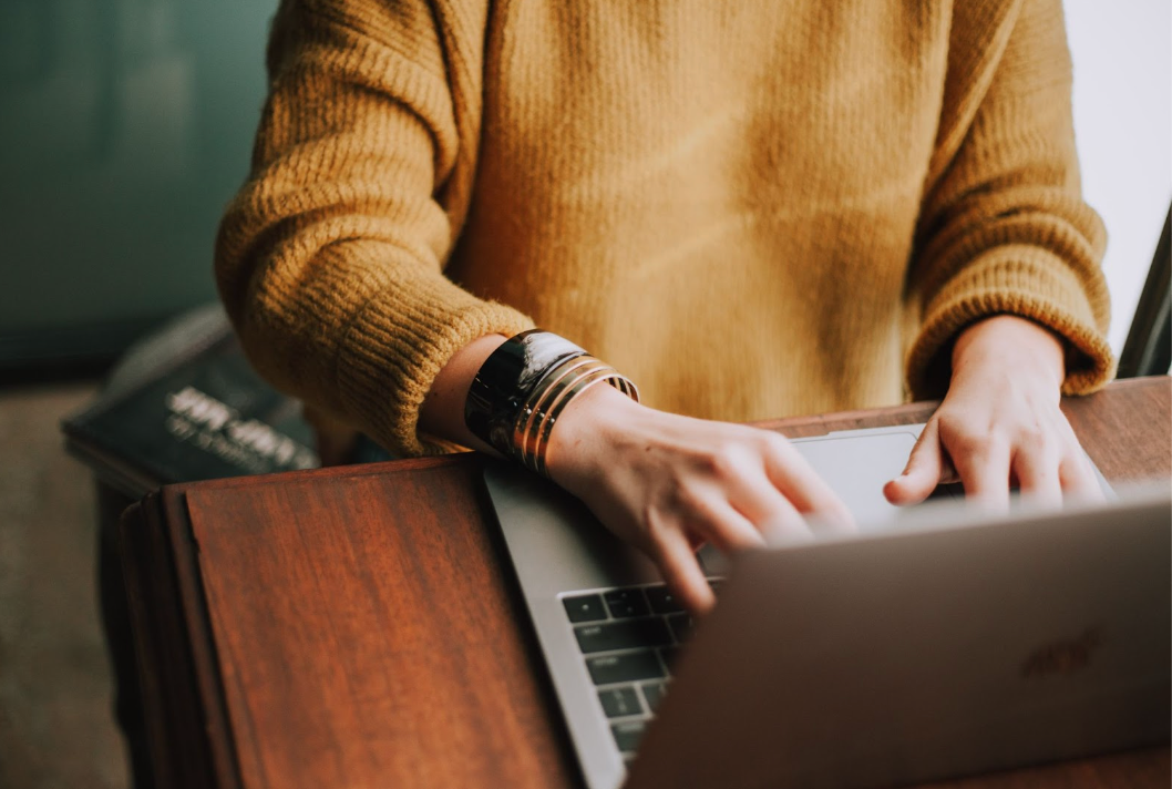 A Robin employee on her laptop