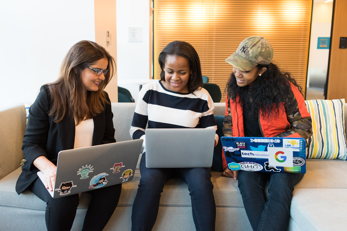 Three Woman working on their laptops together