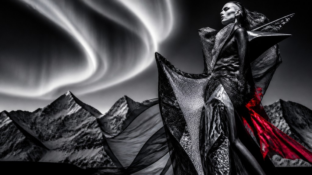 a flowing aurora over snowy peaks, wide sweeping composition, no people, no text — Avant-Garde Fashion Design banner