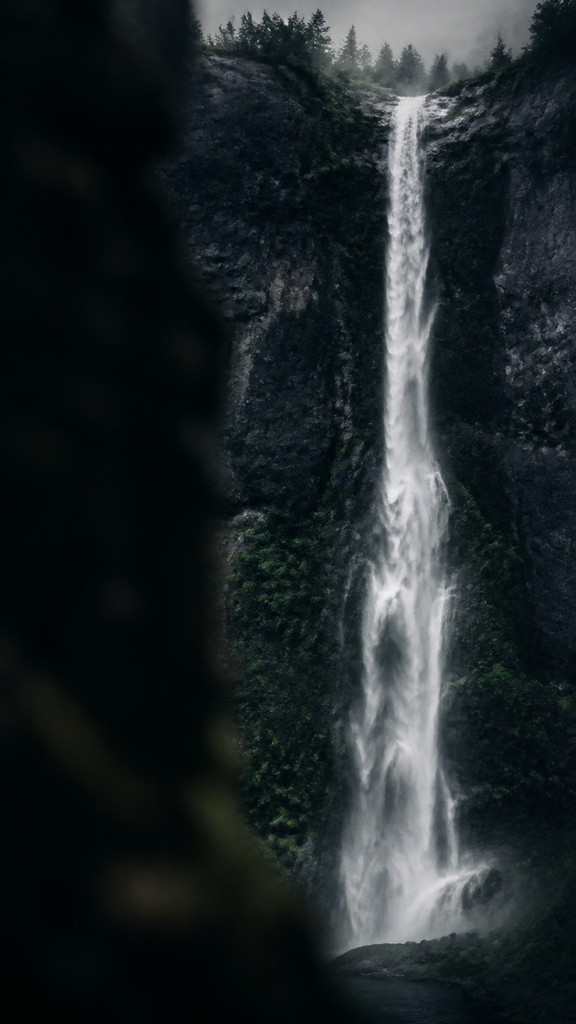 towering waterfall cascading down a cliff — Fine Art Photography Style
