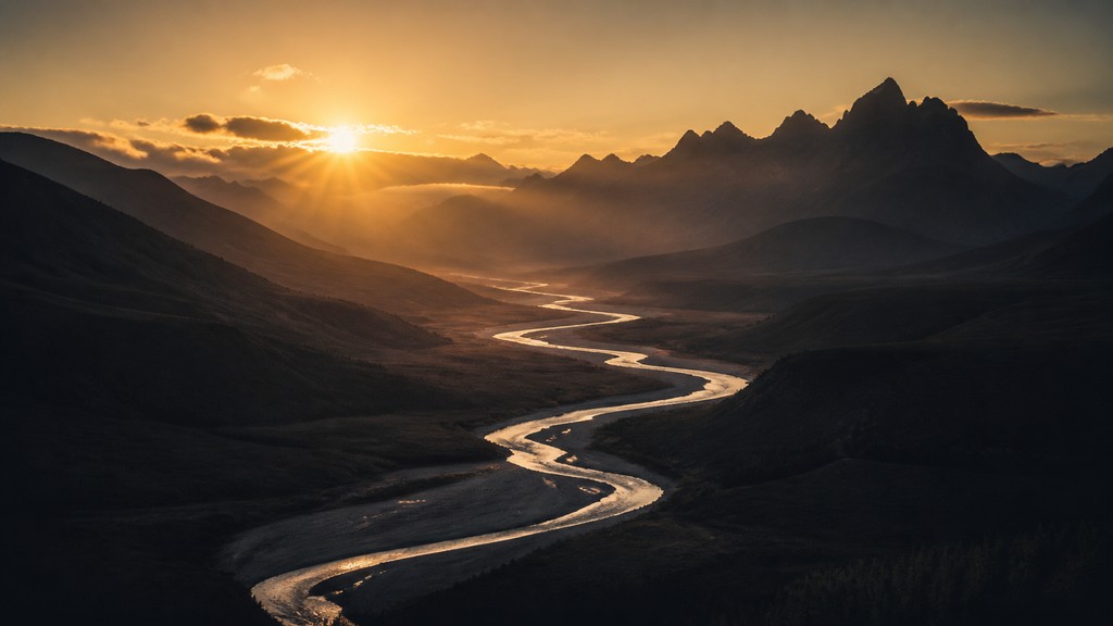 a vast valley with a river winding toward distant mountains at sunrise, no people, no text — Fine Art Photography Style desktop wallpaper