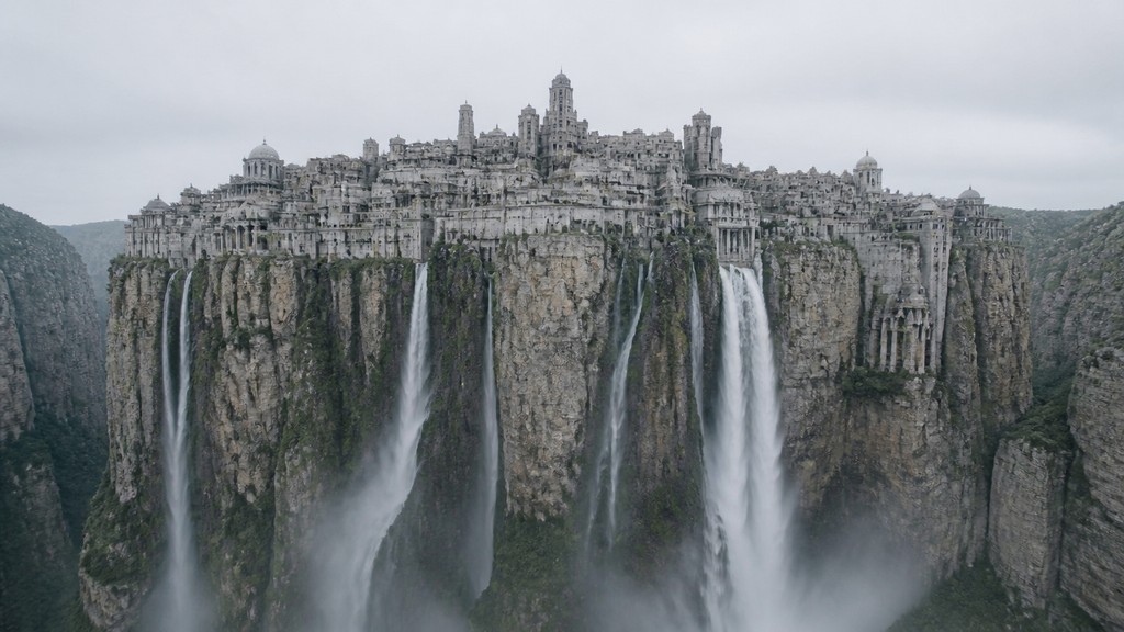 a cliffside city with waterfalls cascading into a misty canyon, wide establishing shot, no people, no text — Photo-Conceptual Art Style concept art