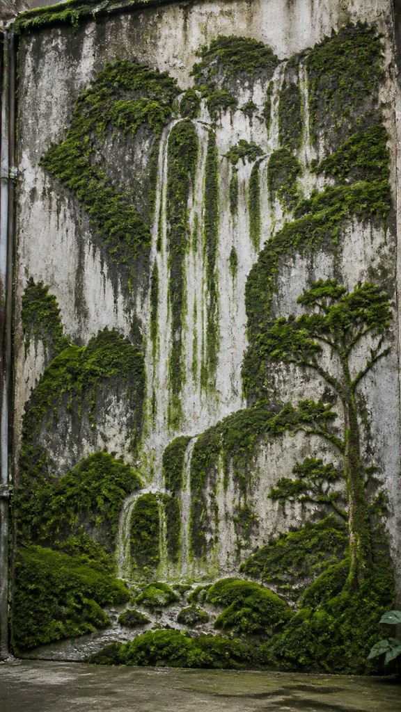 towering waterfall cascading down a cliff — Moss Graffiti Street Art Style