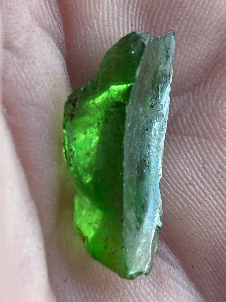 Not a diamond; this specimen appears to be green glass or a green mineral crystal such as rough tourmaline or peridot, but visually lacks diamond characteristics. - Rough crystal / Raw fragment