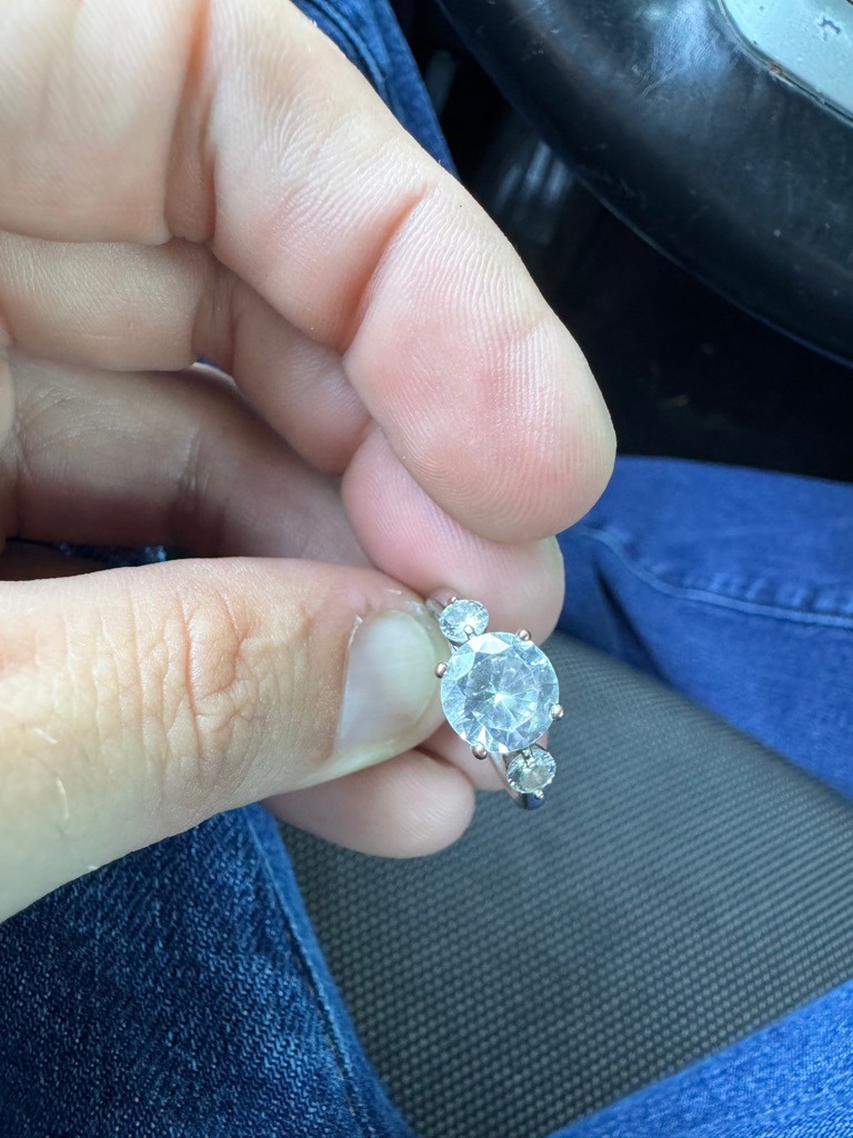 Natural Diamond (Assessed via typical commercial ring setting; professional physical and spectroscopic testing required for absolute confirmation) - Round Brilliant