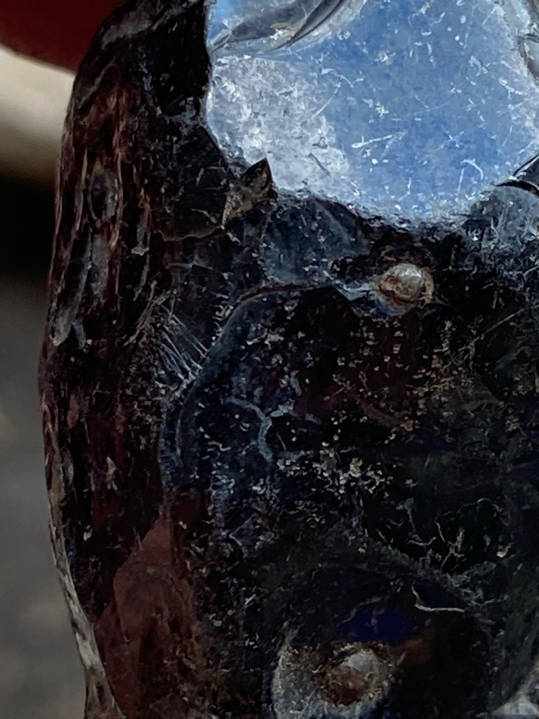 Not a diamond; this specimen appears to be industrial slag glass, obsidian, or a similar glassy/siliceous material showing typical conchoidal fracture patterns rather than a crystallized diamond or rough diamond crystal. - Rough / Uncut (Irregular nodule with conchoidal fracture)