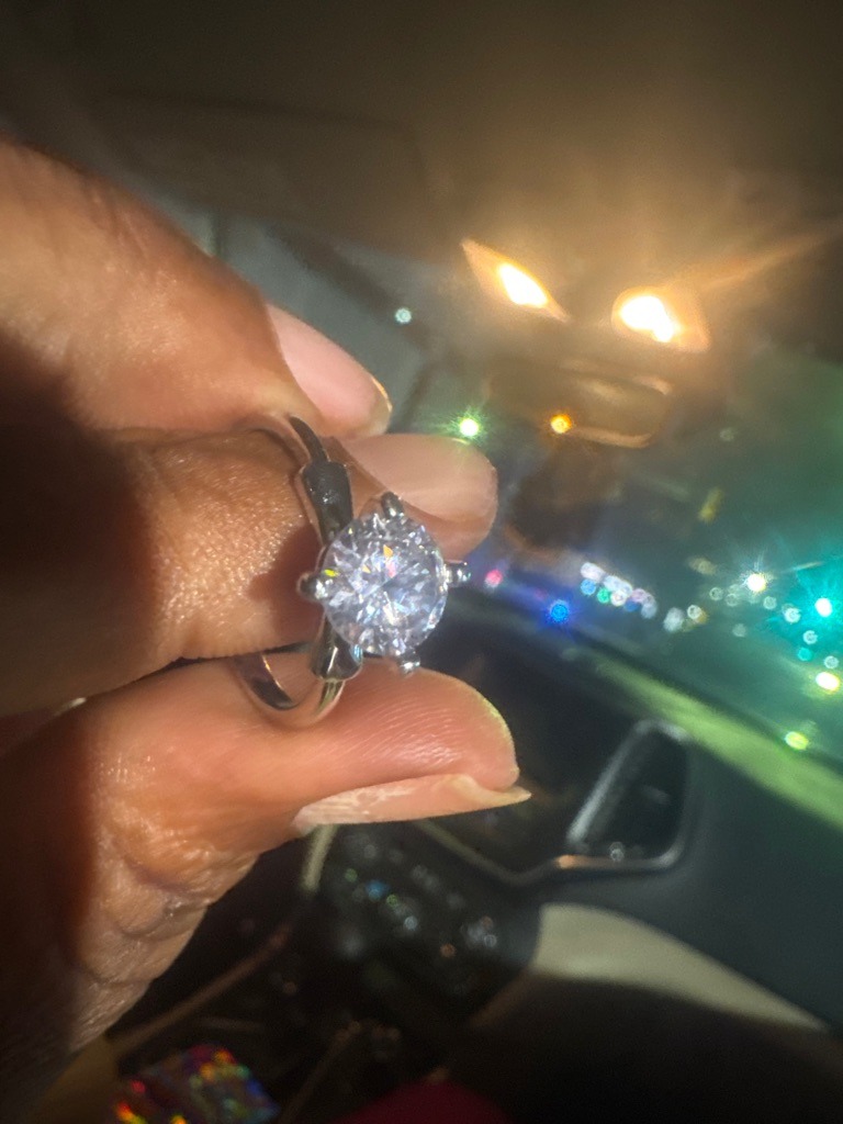 Natural Diamond (estimated based on typical jewelry presentation) - Round Brilliant