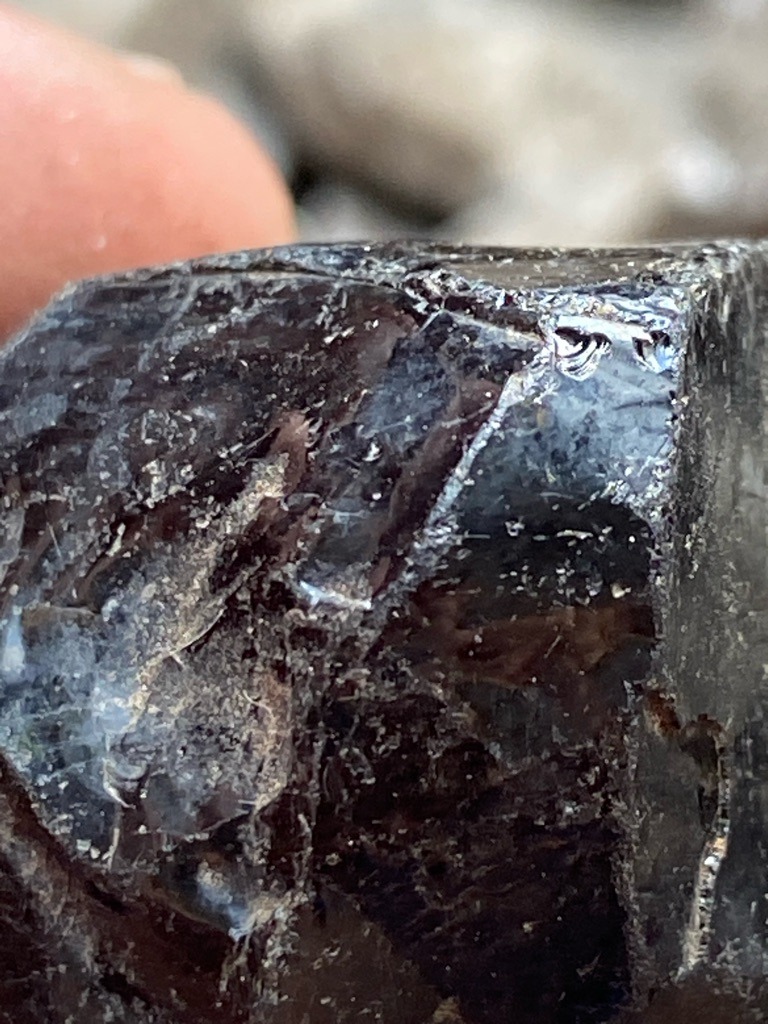 Not a diamond; appears to be a dark mineral specimen such as tourmaline, obsidian, or dark quartz/slag - Rough crystal fragment / irregular uncut chunk