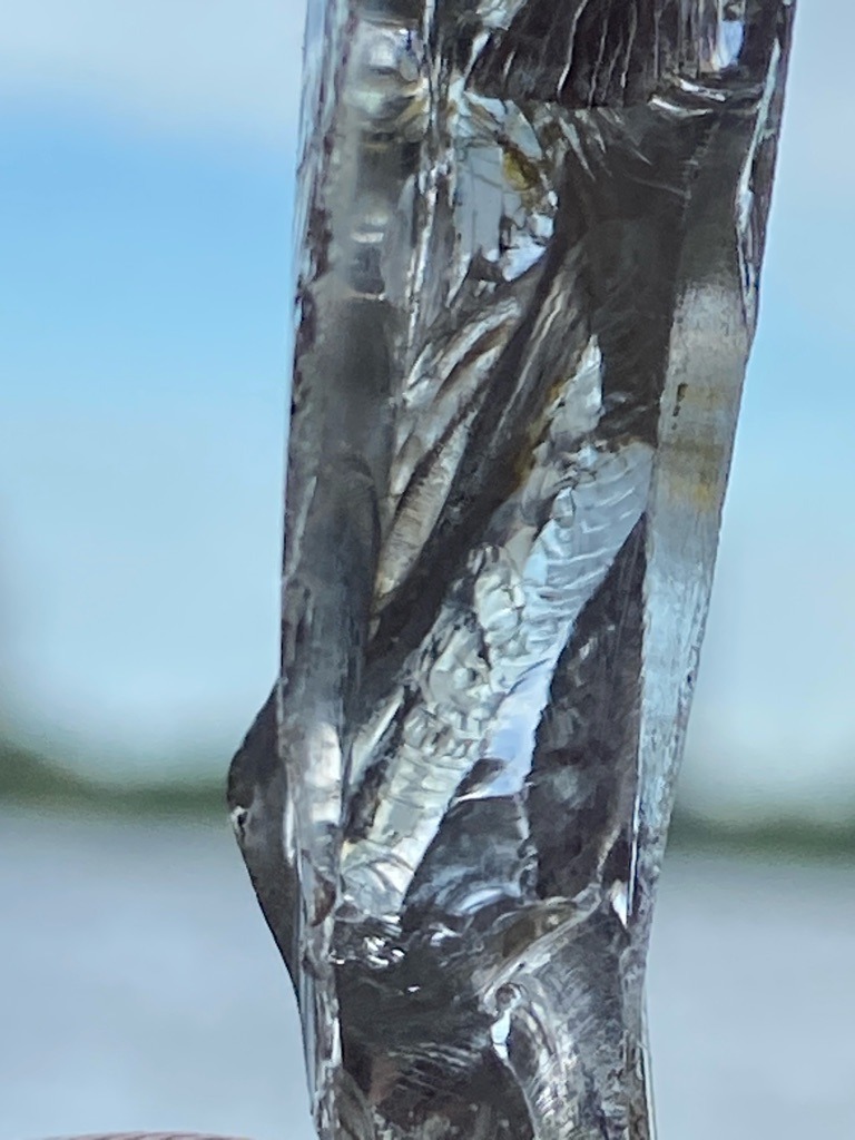 Not a diamond; this is a transparent icicle or water ice formation. - Irregular natural column (uncut formation)