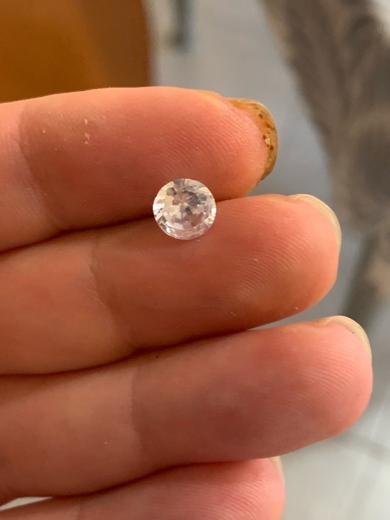 Likely Moissanite or high-grade Cubic Zirconia based on high dispersion/doubling visible - Round Brilliant