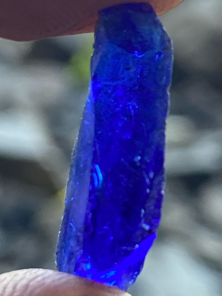 Not a diamond; this is a rough blue gemstone, likely sapphire or a similar mineral specimen, showing strong blue coloration. - Rough crystal / Uncut elongated crystal formation