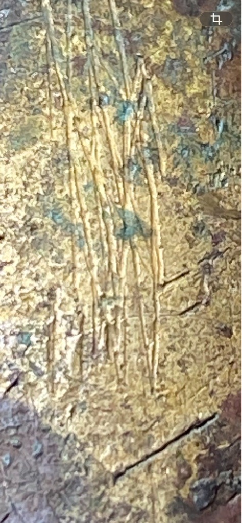 Not a diamond (appears to be a textured wood grain or worn painted surface) - Not applicable