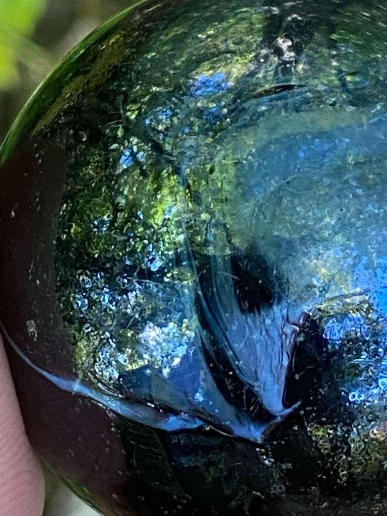 Not a diamond; this object appears to be a glass or slag glass orb, likely a decorative or industrial glass specimen. - Spherical / Orb