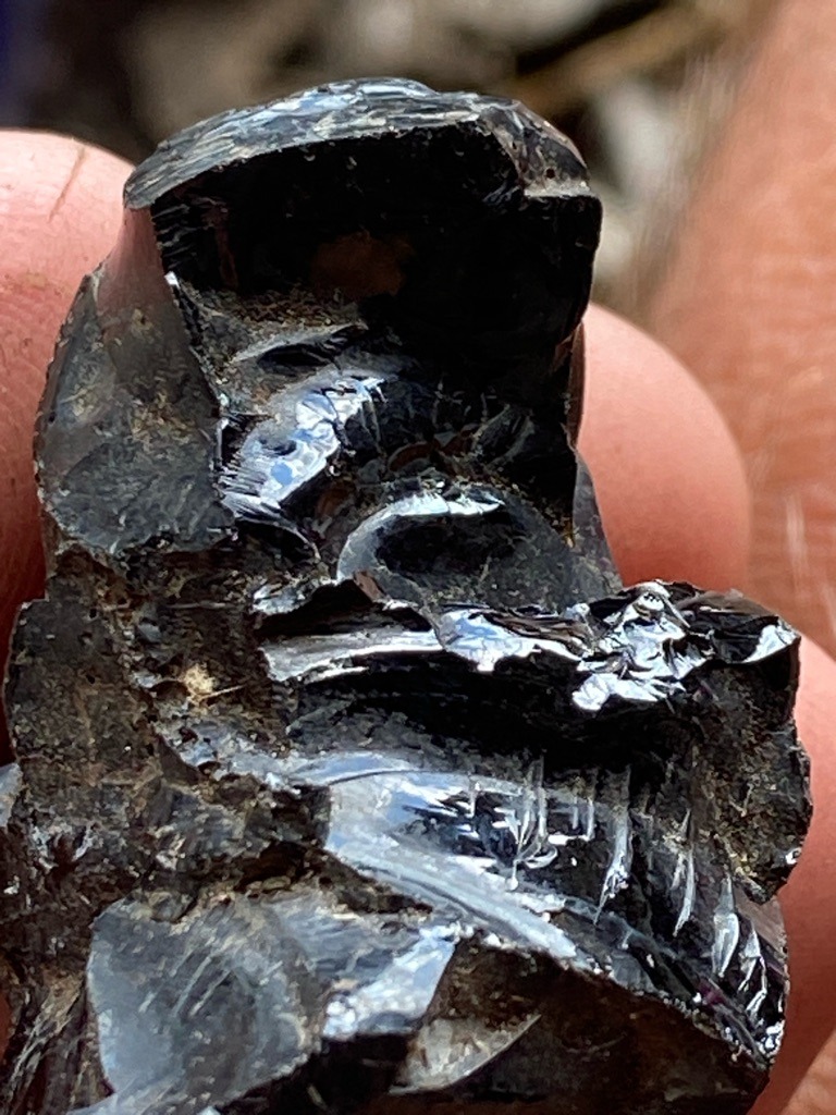 Not a diamond; appears to be raw obsidian or black glass with conchoidal fracture patterns - Rough uncut nodule / Irregular raw mineral specimen
