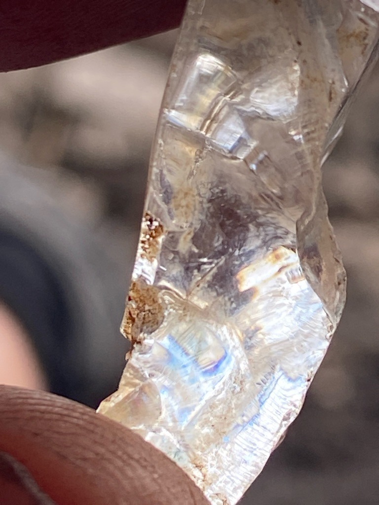 Not a diamond; this specimen appears to be rough quartz or mineral glass with natural fractures and inclusions. - Rough / Uncut irregular crystal fragment