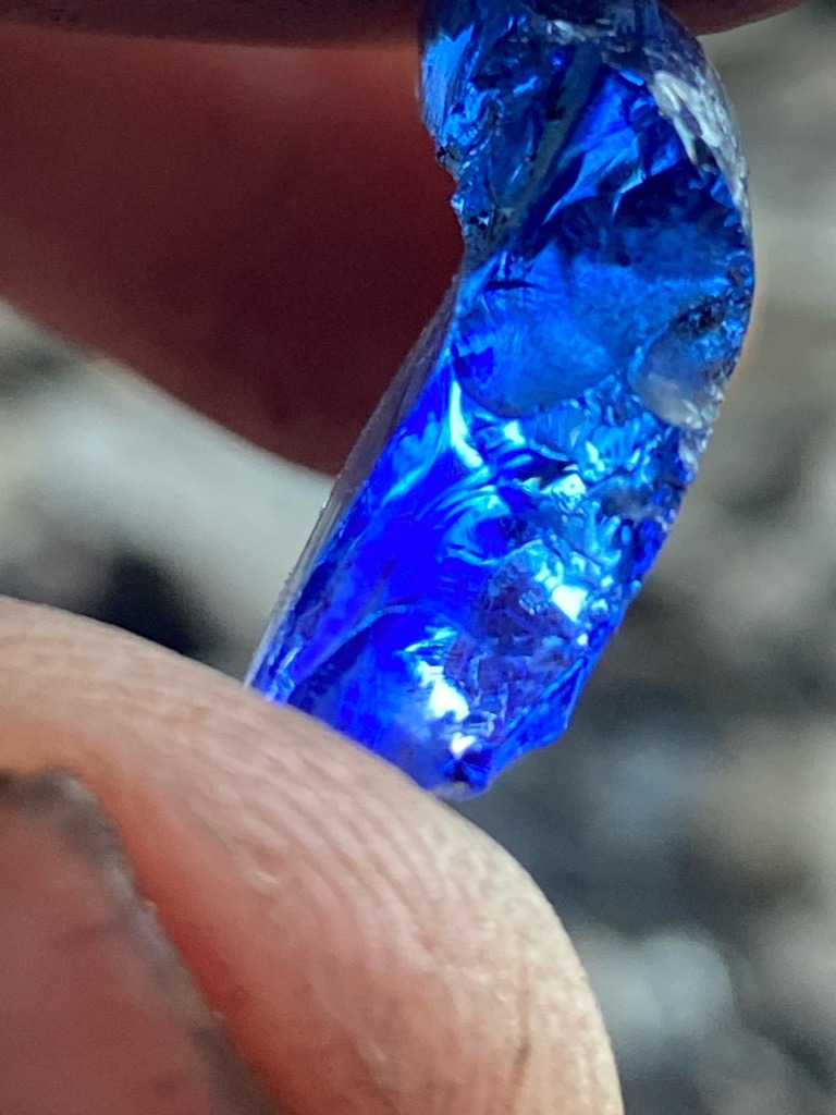 Not a diamond; this is a rough blue gemstone, likely blue glass or synthetic spinel/sapphire material, given the conchoidal fracture and deep electric blue color. - Rough crystal fragment with irregular natural or fractured shape