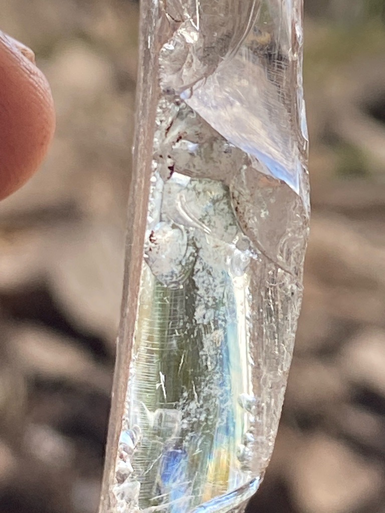 Not a diamond; this specimen appears to be a natural raw crystal, likely quartz or beryl, showing typical rough crystal striations and fracture patterns rather than crystalline carbon (diamond). - Raw, uncut, elongated crystal rough