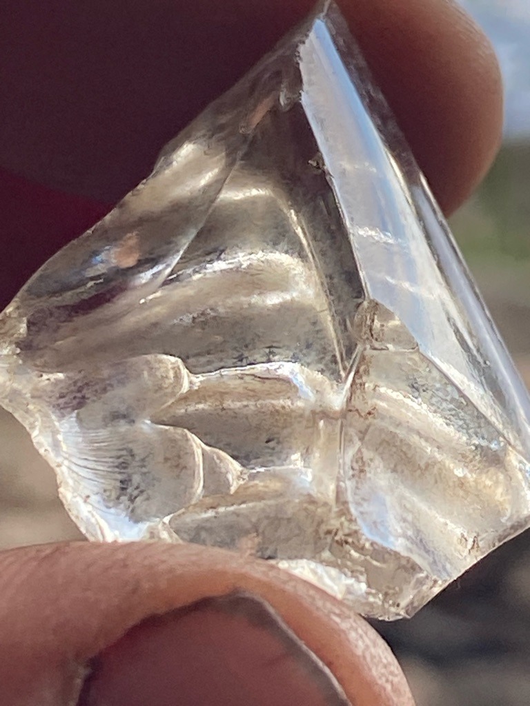 Natural rough crystal / Uncut mineral specimen (likely Quartz, Herkimer Diamond, or low-grade industrial diamond specimen given conchoidal fracture patterns) - Uncut natural crystal / Irregular rough fragment