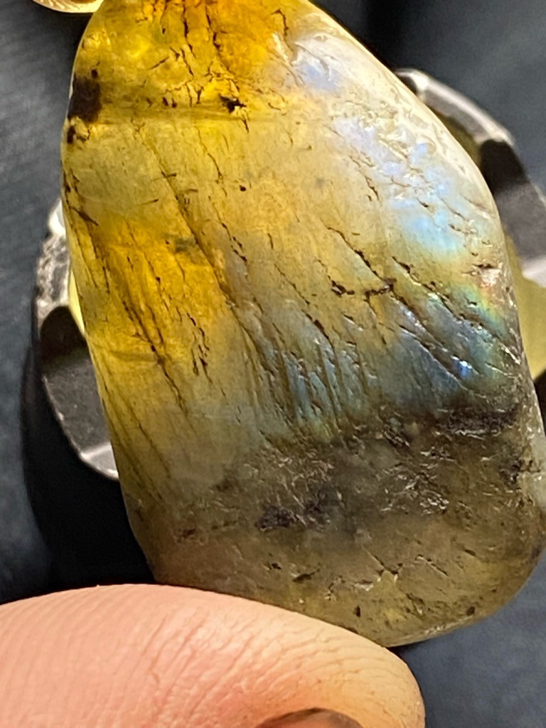 Not a diamond; this is actually Labradorite, a feldspar mineral exhibiting labradorescence. - Freeform cabochon / tumbled piece