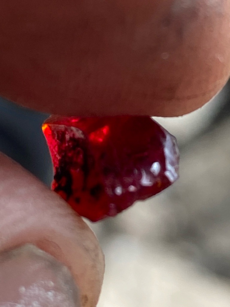Natural Fancy Red Diamond (or potentially a red gemstone such as ruby/spinel pending physical testing, but evaluated as a rare fancy colored diamond based on appearance) - Rough / Uncut Crystal (Sub-angular, distorted crystal habit)