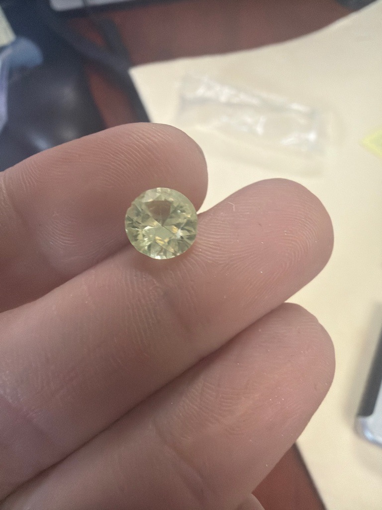 Natural Diamond (or potentially a fancy-colored gemstone such as yellow sapphire or quartz, but assuming diamond context) - Round Brilliant