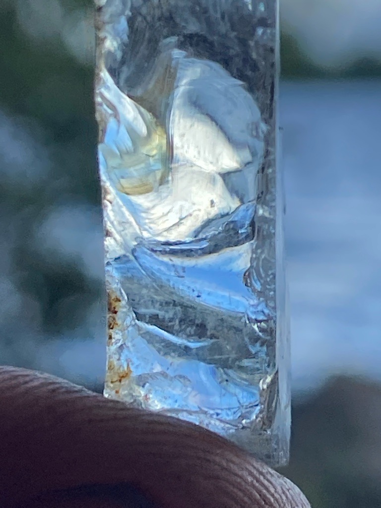 Not a diamond; appears to be quartz, glass, or an alternative mineral specimen - Irregular raw crystal / elongated slab