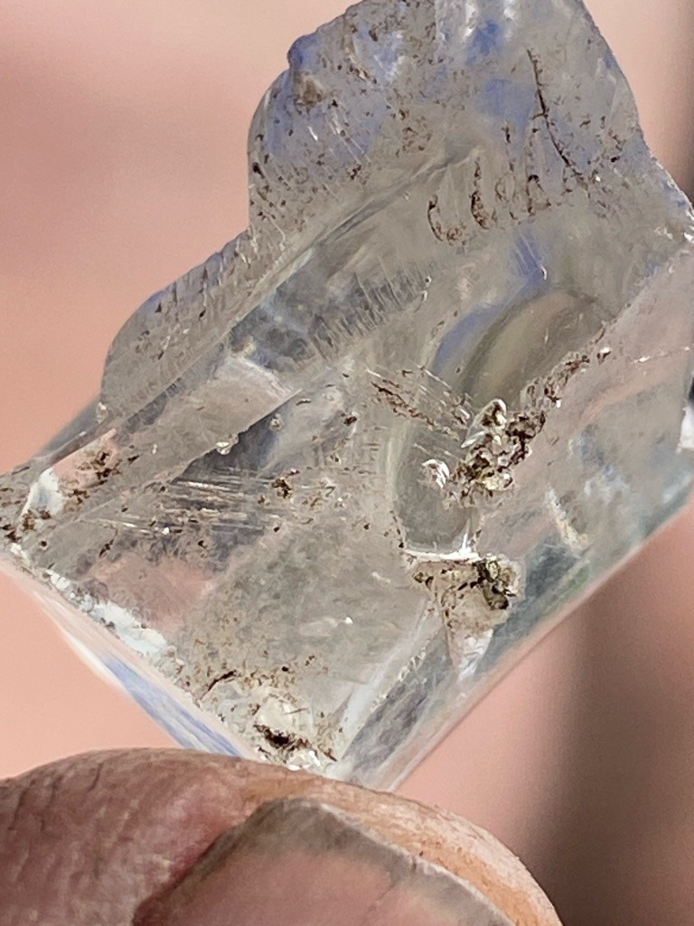 Not a diamond; appears to be a raw mineral crystal or synthetic crystalline material with heavy inclusions. - Uncut or raw crystalline form, irregular chunk