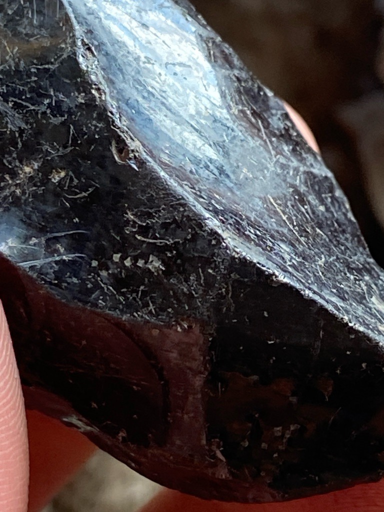 Not a diamond; this specimen appears to be an unpolished or rough mineral crystal, possibly carbonado (black diamond rough), hematite, or obsidian/slag glass, but visually lacks the typical adamantine luster of gem-grade diamond. - Raw / Rough crystal