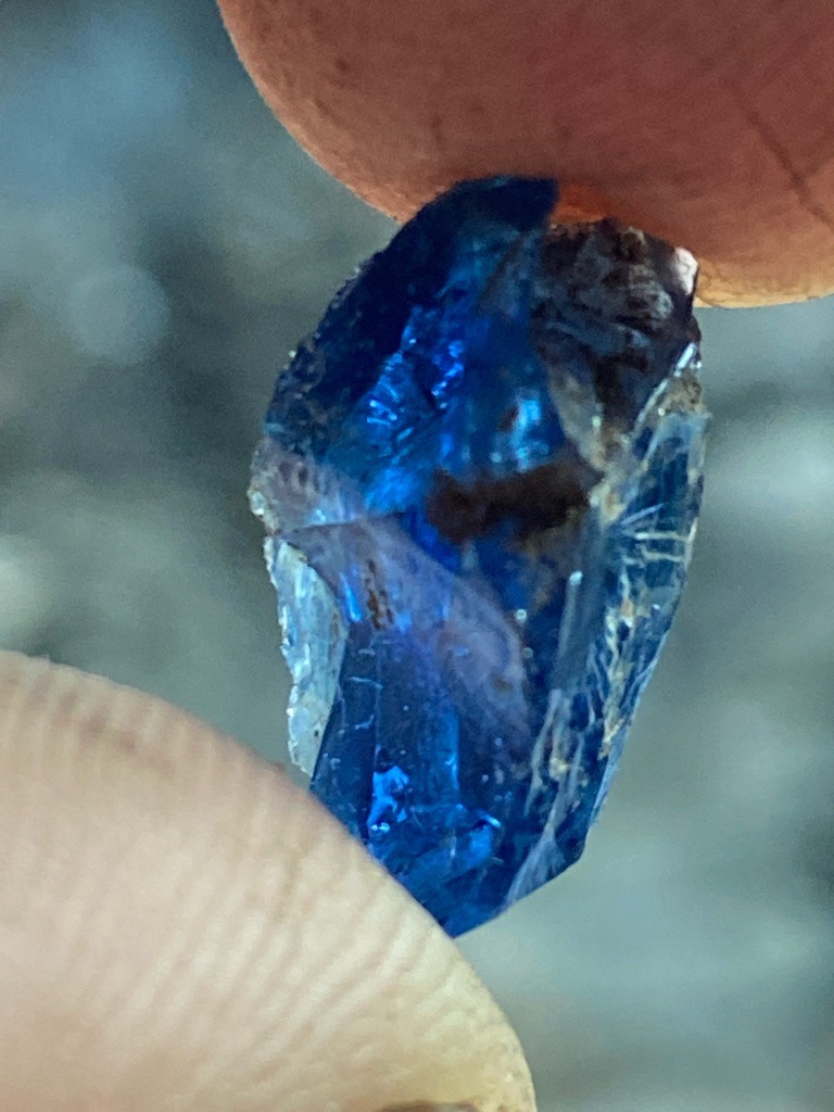 Not a diamond; this specimen appears to be a natural rough blue gemstone, likely blue sapphire or kyanite based on the deep blue color and crystalline structure. - Rough, uncut, irregular crystal form (uncut mineral specimen)