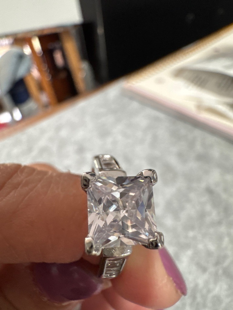 Natural Diamond (estimated based on appearance, though lab-grown or high-grade simulant like CZ/moissanite cannot be definitively ruled out without physical testing) - Princess Cut (Square Modified Brilliant)