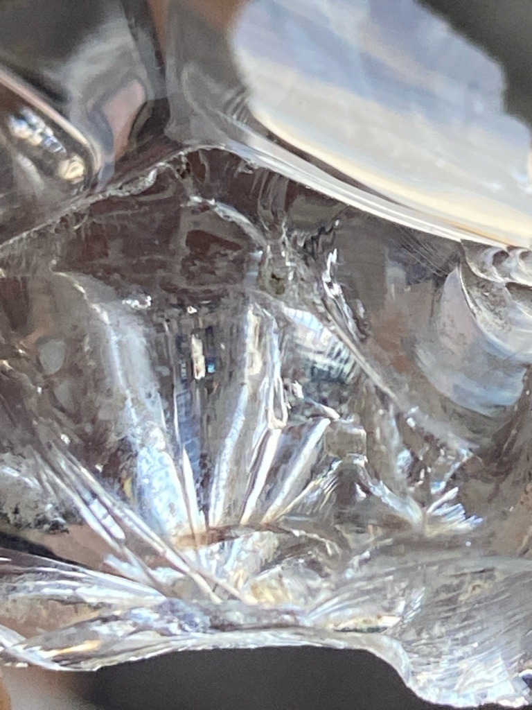 Not a diamond; appears to be raw quartz, glass, or similar transparent crystalline mineral material. - Irregular / Raw crystal form