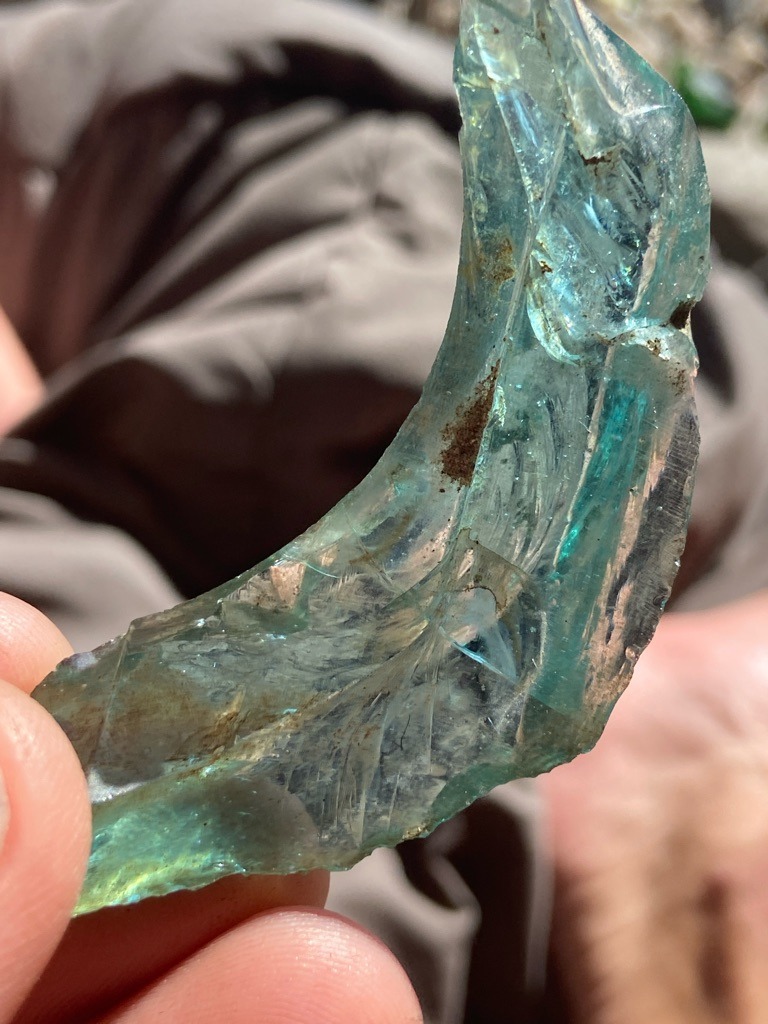 Not a diamond; this is a piece of industrial or decorative glass slag featuring characteristic conchoidal fracture patterns. - Irregular / Raw Fragment