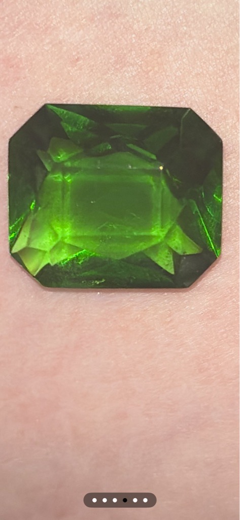 Natural Green Diamond or possibly Green Tourmaline/Emerald (Visual assessment indicates a vibrant green gemstone, likely a naturally irradiated green diamond or another green colored gemstone like tourmaline given the deep hue) - Emerald Cut