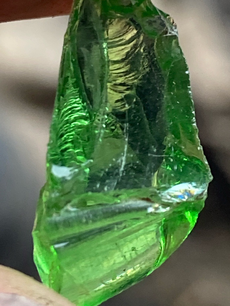 Not a diamond (appears to be green glass / slag glass with conchoidal fractures) - Rough / Ungraded / Irregular fragment