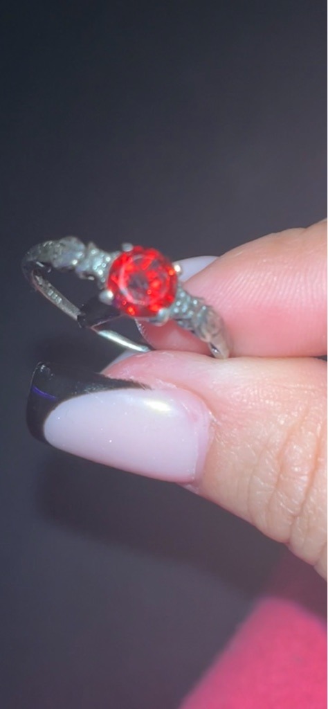 Not a diamond; visual indicators suggest a synthetic red gemstone or colored glass (imitation ruby) - Round Brilliant