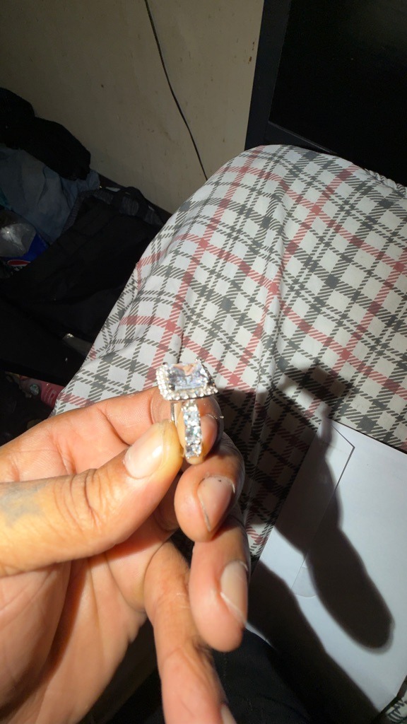 Lab-Grown / Simulated (Likely Cubic Zirconia or Moissanite given the extreme visual size and setting style) - Radiant Cut