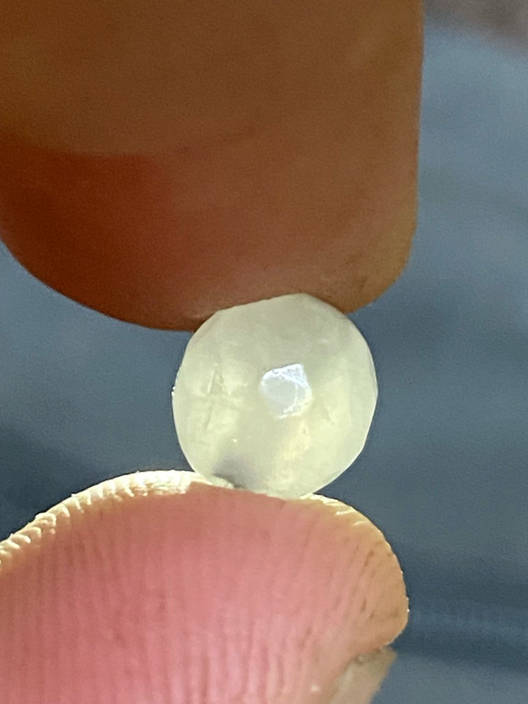 Natural rough diamond, likely industrial or near-gem quality - Rough crystal / Uncut rounded octahedral or macle form with primitive faceting/wear