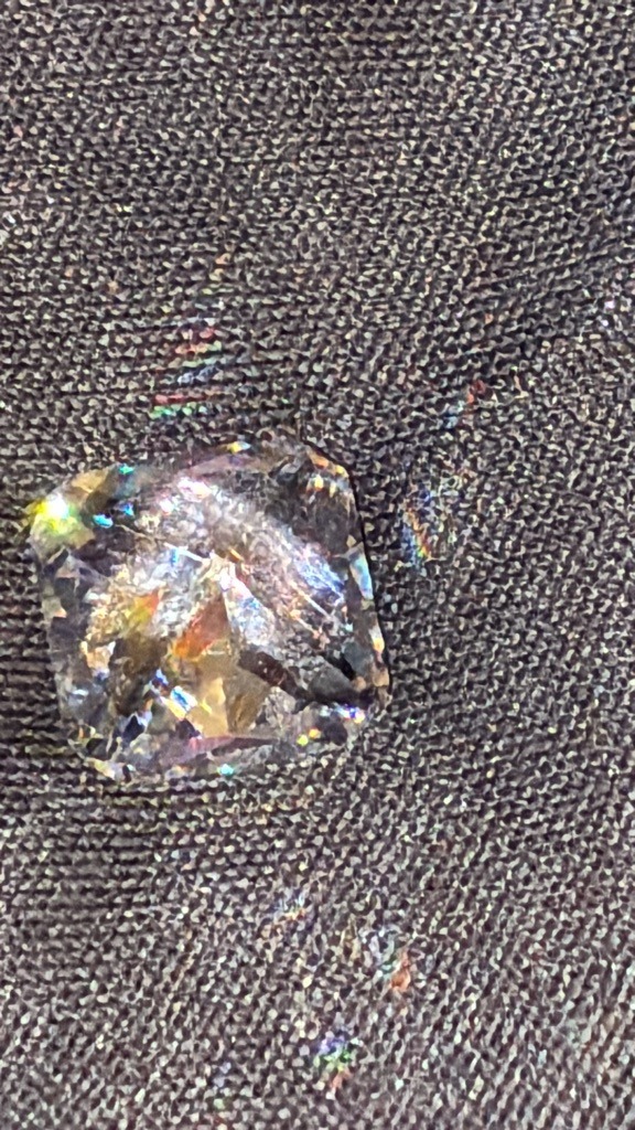 Synthetic Simulant (likely Moissanite or high-dispersion crystal due to rainbow flash) - Cushion Brilliant