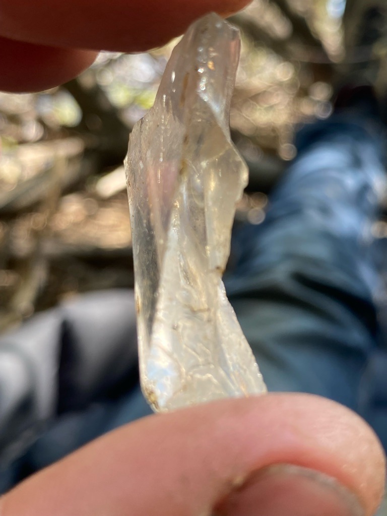 The specimen appears to be non-diamond mineral, likely a piece of Quartz (rock crystal) or potentially common glass slag/silica, as it lacks the characteristic octahedral or dodecahedral crystal habit of raw diamond. - Irregular / Rough (Uncut)