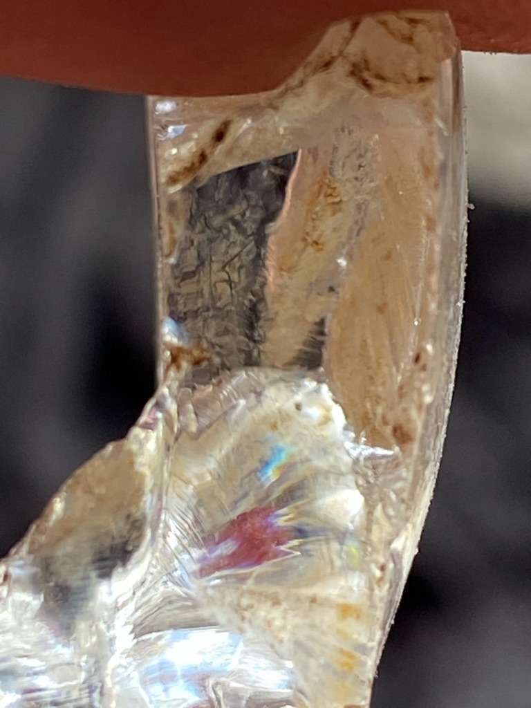 Not a diamond; appears to be quartz crystal, glass, or an industrial slag/resin piece with heavy inclusions and fractures. - Irregular / Raw fragment