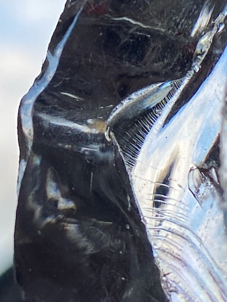 Not a diamond; appears to be industrial silicon, glass, or a synthetic metallic crystal fragment with conchoidal fracture and metallic luster. - Irregular / Raw Crystalline Fragment