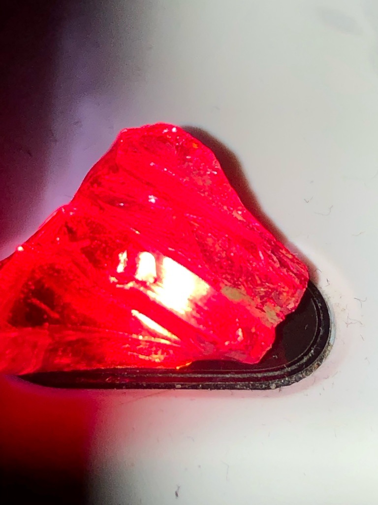 Natural (likely synthetic or glass imitation based on intense fluorescence/color under UV or direct light, but analyzing as requested rough specimen) - Rough crystal / Irregular shape