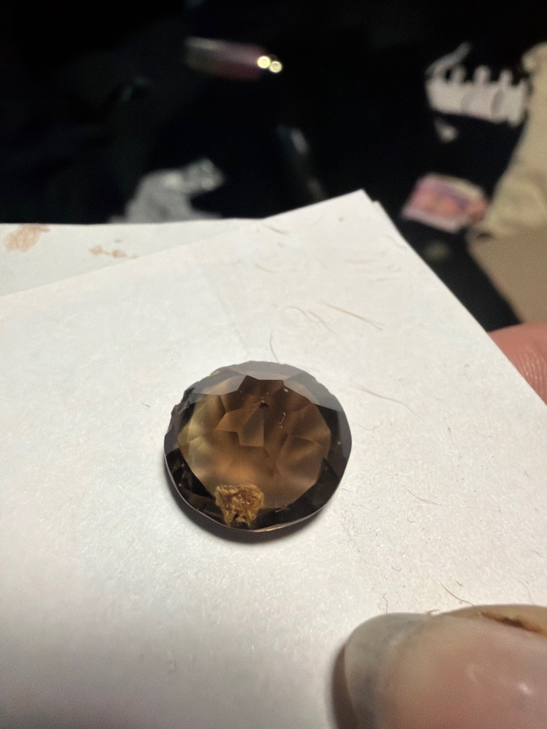 Not a diamond; this gemstone appears to be Smoky Quartz with a significant inclusion/cavity at the edge. - Round mixed cut / Rose cut hybrid
